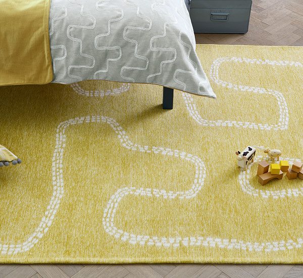 Pitter Patter Rug Sandpit in a room setting